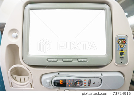 Aircraft monitor in passenger seat isolated on white background for your advertising design 73714916