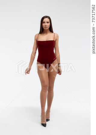 Seductive woman in bodysuit in studio Seductive woman in bodysuit in studio 73717562