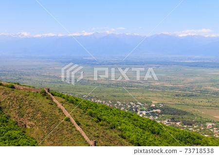 View on Alazani valley and old city wall from with towers round a city Sighnaghi, Kakheti, Georgia 73718538
