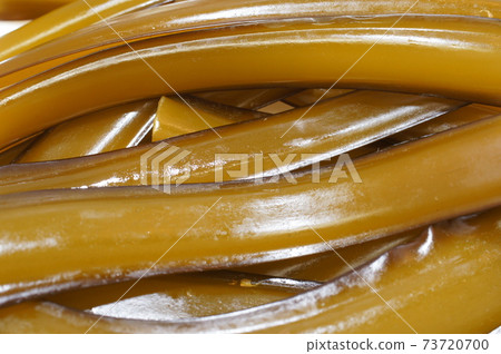 Freshly picked! Brown fresh raw stem wakame seaweed before boiling Full close-up image Freshly picked! Brown fresh raw stem wakame seaweed before boiling Full close-up image 73720700
