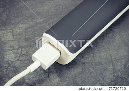 External powerbank using to charging empty battery of smartphone, mobile phone or other device External powerbank using to charging empty battery of smartphone, mobile phone or other device 73720710