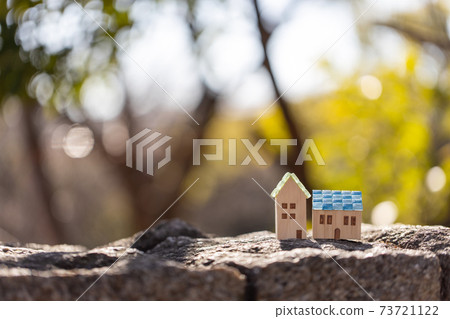 A small house with a mosaic glass roof 73721122