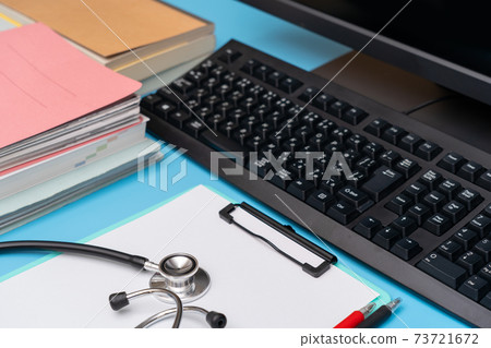 Stethoscope and writing utensils Stethoscope and writing utensils 73721672