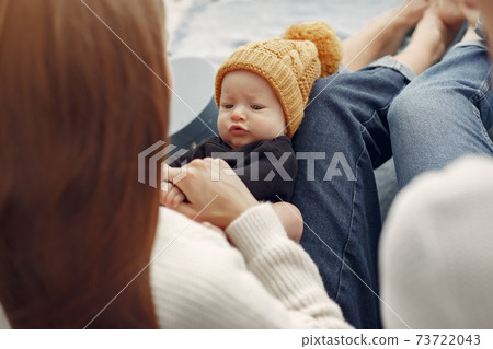 Elegant grandma at home with daughter and grandson Elegant grandma at home with daughter and grandson 73722043