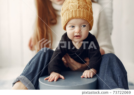 Elegant grandma at home with daughter and grandson Elegant grandma at home with daughter and grandson 73722069