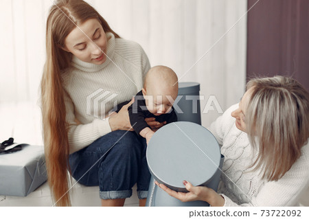 Elegant grandma at home with daughter and granddaughter Elegant grandma at home with daughter and granddaughter 73722092