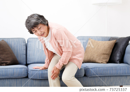 Senior woman joint pain 73725337