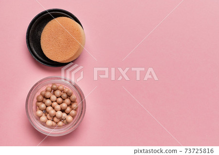 Powder on a pink background with copy space. 73725816