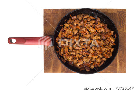 Fried meat in a pan. Fried pieces of pork in a pan cooked for filling noodles.Top view Fried meat in a pan. Fried pieces of pork in a pan cooked for filling noodles.Top view 73726147