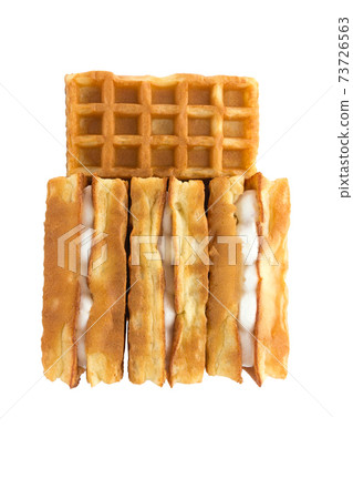 Soft waffles with a filling. Several waffles with a cream filling on a white background. Top view. 73726563