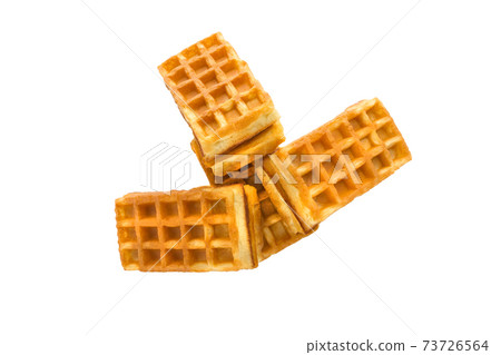 Soft waffles with a filling. Several waffles with a cream filling on a white background. Top view. Soft waffles with a filling. Several waffles with a cream filling on a white background. Top view. 73726564