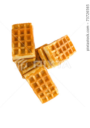 Soft waffles with a filling. Several waffles with a cream filling on a white background. Top view. 73726565