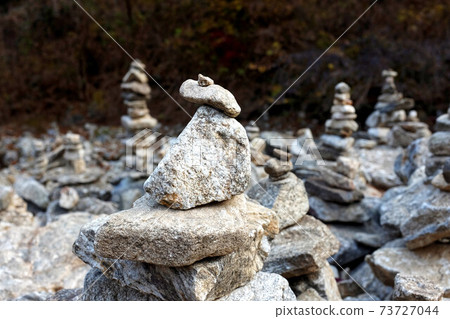 Close up of rocks stacked one on top of another. Close up of rocks stacked one on top of another. 73727044