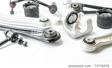 Car motor parts. Auto motor mechanic spare or automotive piece on white background. Set of new metal car part. Repair and vehicle service. Car motor parts. Auto motor mechanic spare or automotive piece on white background. Set of new metal car part. Repair and vehicle service. 73730676