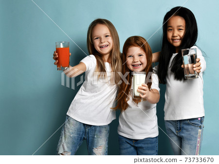 Happy girls friends children in white t-shirts Happy girls friends children in white t-shirts 73733670