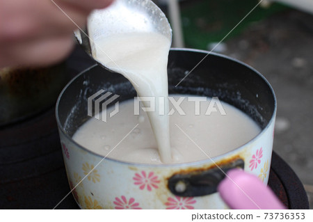 Making amazake with an outdoor wood stove Making amazake with an outdoor wood stove 73736353