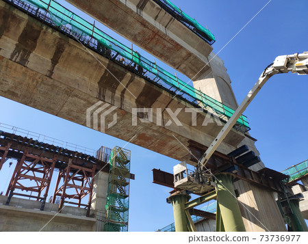 PENANG, MALAYSIA - MARCH 21, 2020: Overhead road under construction. The massive concrete column used to support the concrete road deck. Construction work is in full swing. 73736977