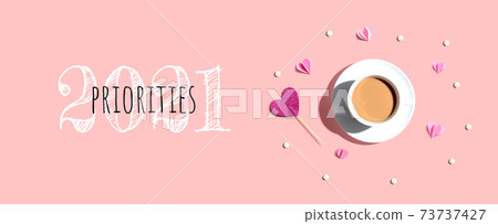 Priorities 2021 concept with a cup of coffee and paper hearts Priorities 2021 concept with a cup of coffee and paper hearts 73737427
