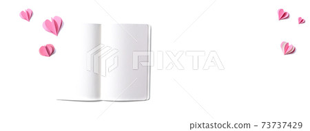 White notebook with paper hearts 73737429