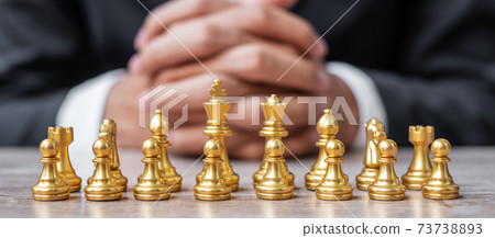 Gold Chess figure team (King, Queen, Bishop, Knight, Rook and Pawn) with businessman manager background. Strategy, Success, management, business planning, tactic, thinking, vision and leader concept Gold Chess figure team (King, Queen, Bishop, Knight, Rook and Pawn) with businessman manager background. Strategy, Success, management, business planning, tactic, thinking, vision and leader concept 73738893