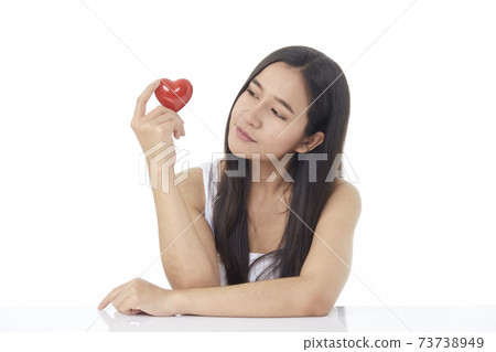 Womon brunette long hair holding red heart love 73738949