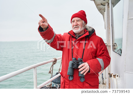 Man looking into the distance and pointing away Man looking into the distance and pointing away 73739543