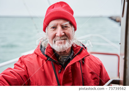 Marine chief officer or captain on deck of vessel 73739562