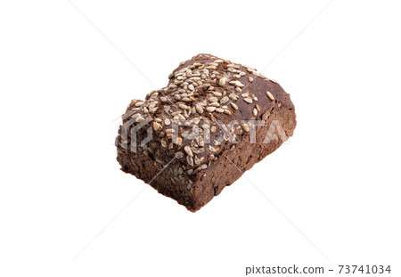 Homemade rye bread with sunflower seeds over white background. Homemade rye bread with sunflower seeds over white background. 73741034