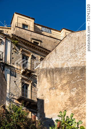 Old abandoned houses in a staircase road, Castiglione di Sicilia, ITA 73741220