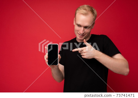 Photo of handsome smiling adult male person good looking wearing casual outfit standing isolated on Photo of handsome smiling adult male person good looking wearing casual outfit standing isolated on 73741471