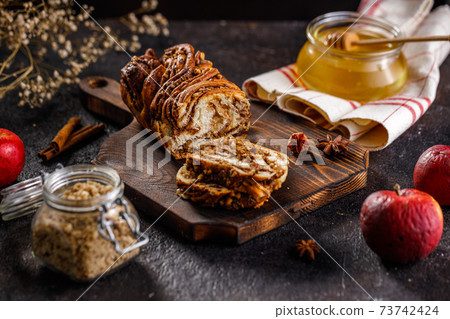 Swirl brioche or traditional Polish babka cake with walnut, apple and honey 73742424