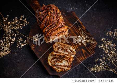 Swirl brioche or traditional Polish babka cake Swirl brioche or traditional Polish babka cake 73742430