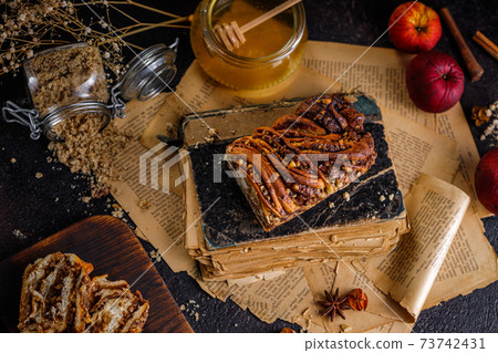 Swirl brioche or traditional Polish babka cake with walnut, apple and honey 73742431