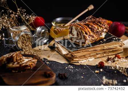 Swirl brioche or traditional Polish babka cake with walnut, apple and honey 73742432