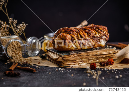 Swirl brioche or traditional Polish babka cake with walnut, apple and honey 73742433