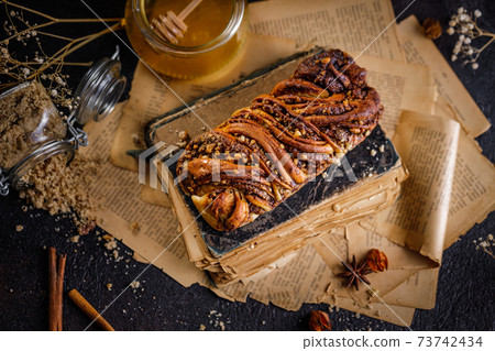 Swirl brioche or traditional Polish babka cake with walnut, apple and honey 73742434