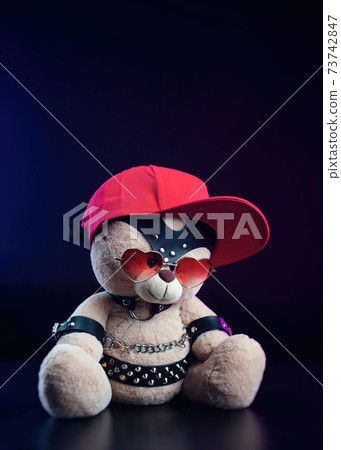 toy bear with glasses in the form of a heart and a red baseball cap on a leather belt accessory for BDSM games gift for Valentine's day toy bear with glasses in the form of a heart and a red baseball cap on a leather belt accessory for BDSM games gift for Valentine's day 73742847