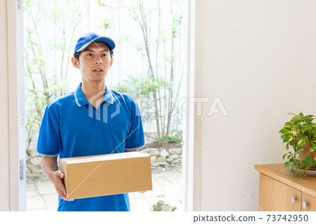 Home delivery driver man working in the transportation industry 73742950