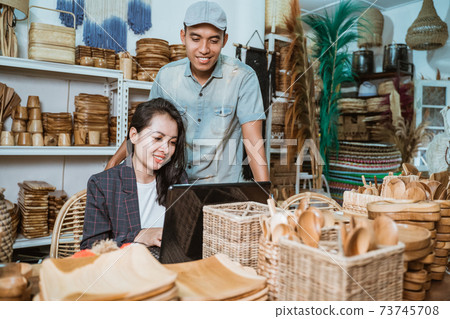 a male businessman standing next to a female secretary a male businessman standing next to a female secretary 73745708