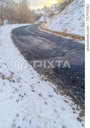 Weathered road on snowy mountain in Salt lake City Weathered road on snowy mountain in Salt lake City 73745982