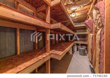 Interior of food cold storage with wooden racks and insulated wall and ceiling Interior of food cold storage with wooden racks and insulated wall and ceiling 73746180