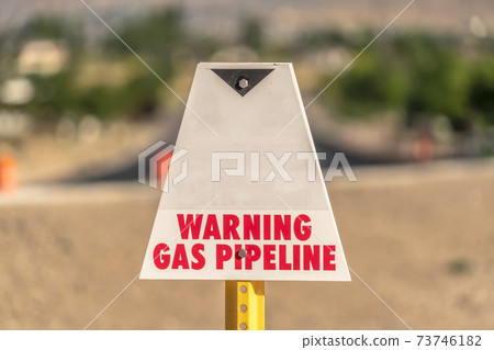 Utility warning sign used to identify and mark underground gas pipelines Utility warning sign used to identify and mark underground gas pipelines 73746182
