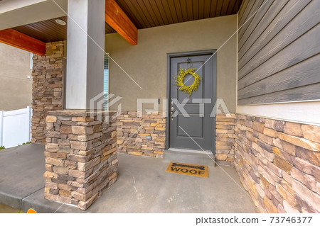 Entrance door to a building with decorative wreath Entrance door to a building with decorative wreath 73746377