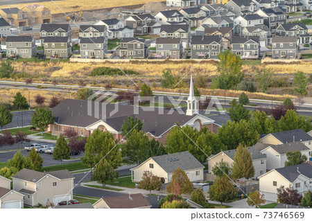 Rooftop view of a church and housing estate Rooftop view of a church and housing estate 73746569