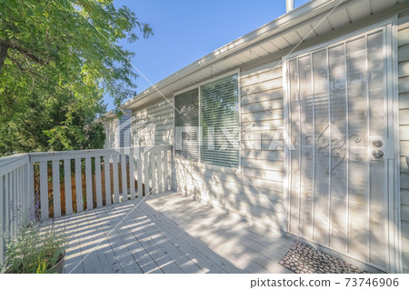 Wooden patio deck on an urban house 73746906