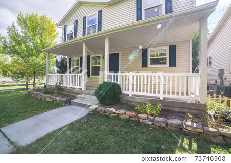 White timber house with shutters and veranda White timber house with shutters and veranda 73746908