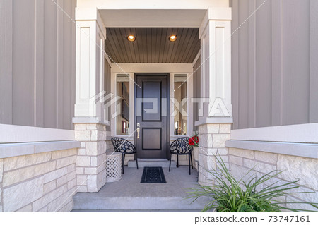 Path leading to front door of a residential house 73747161
