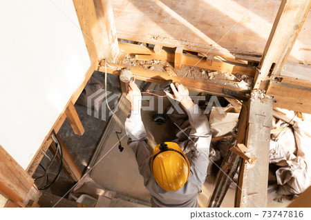 Home remodeling dismantling site Joint box survey businessman 73747816