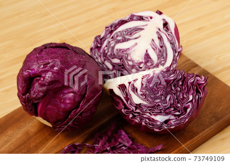 Purple cabbage ready to cook in the kitchen Purple cabbage ready to cook in the kitchen 73749109