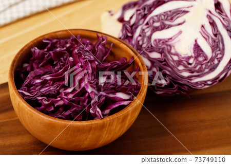 Purple cabbage ready to cook in the kitchen Purple cabbage ready to cook in the kitchen 73749110